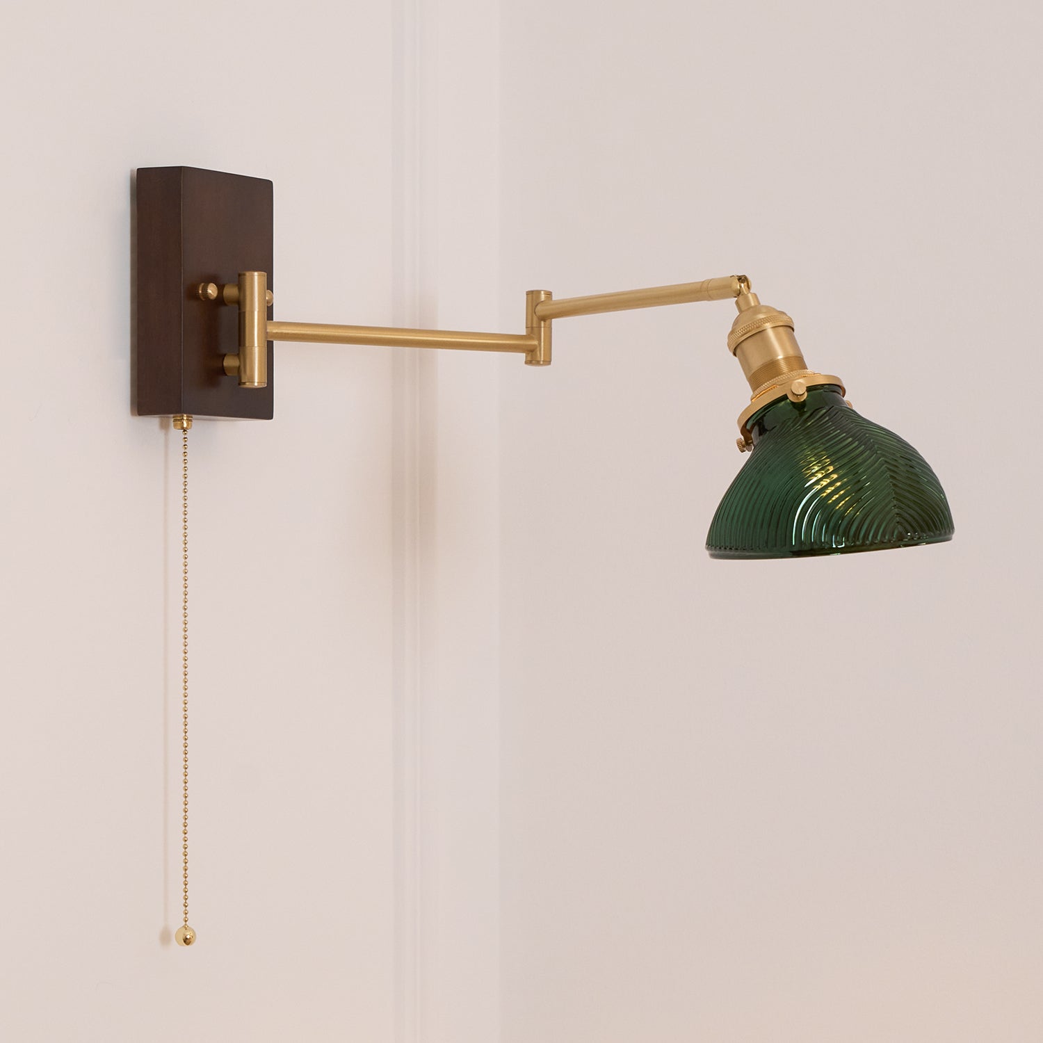 Emeric Adjustable Swing Arm Wall Lamp with Green Glass Shade