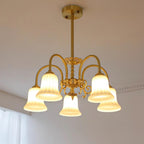 Chandelier with Brass Arms White Glass Shades Opulent Luxe