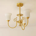 Chandelier with Brass Arms White Glass Shades Opulent Luxe