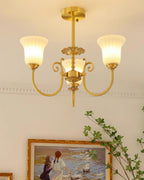 Chandelier with Brass Arms White Glass Shades Opulent Luxe