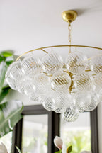 Aurora Chandelier Clear Glass Globe Aged Brass Elegant